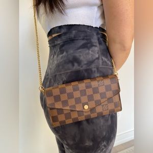 Authentic Louis Vuitton Ebene Sarah wallet with a crossbody strap and box!